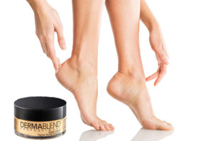 Closeup shot of a woman applying moisturizer to her leg and feet